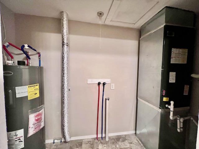 utility room featuring electric water heater