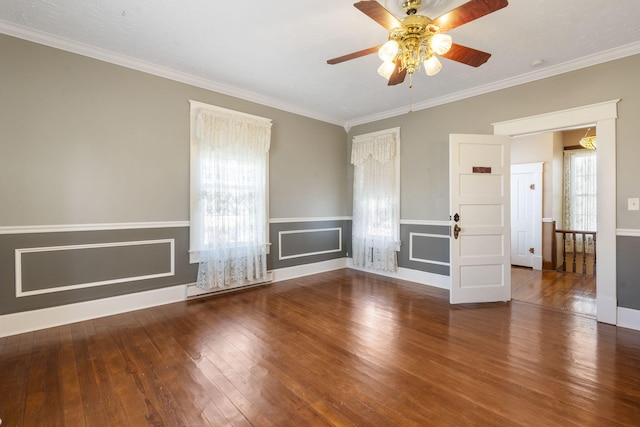 unfurnished living room featuring ceiling fan, wood-type flooring, and ornamental molding