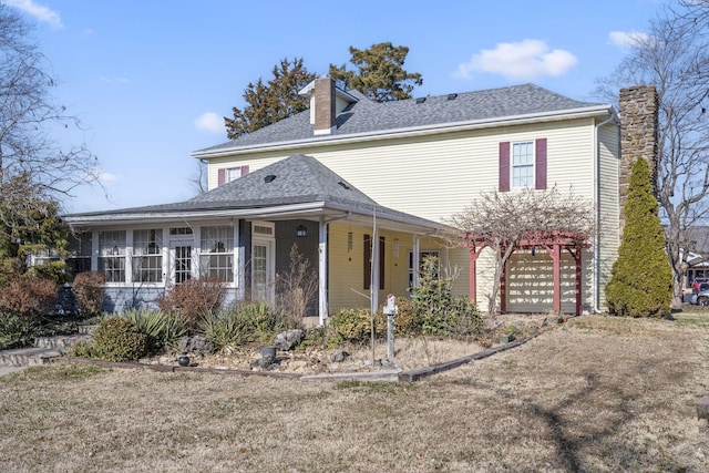 view of front of property with a sunroom