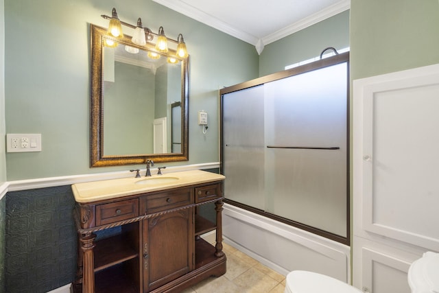 full bathroom featuring vanity, tile patterned floors, combined bath / shower with glass door, crown molding, and toilet