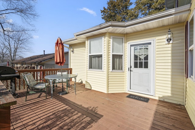 wooden deck with grilling area