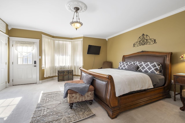 carpeted bedroom featuring ornamental molding