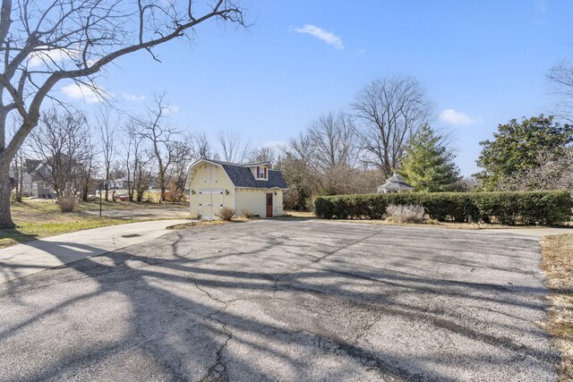 view of property exterior featuring an outbuilding