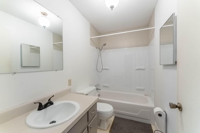 full bathroom featuring washtub / shower combination, vanity, a textured ceiling, and toilet