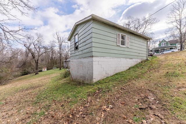 view of property exterior with a yard