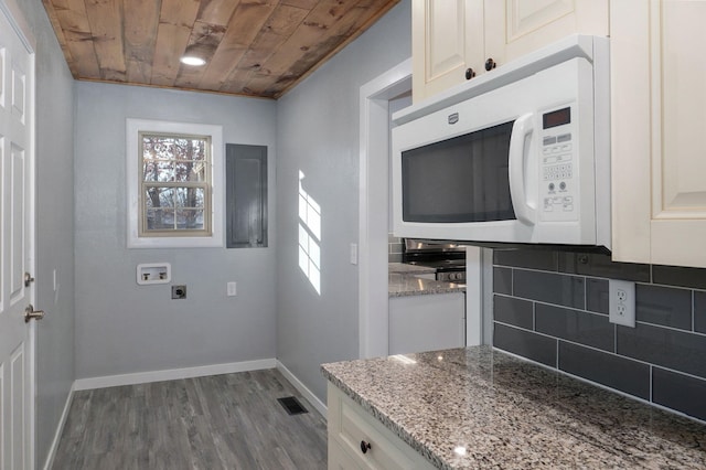 laundry area with washer hookup, a healthy amount of sunlight, dark hardwood / wood-style floors, and wooden ceiling