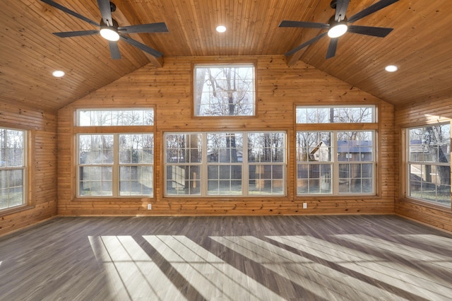 unfurnished sunroom featuring a healthy amount of sunlight, vaulted ceiling with beams, and wooden ceiling