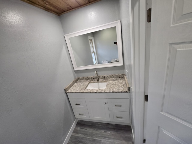 bathroom featuring vanity and hardwood / wood-style floors