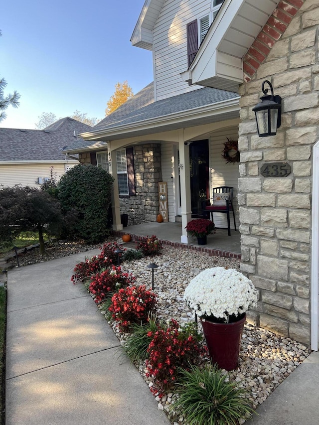 property entrance with covered porch