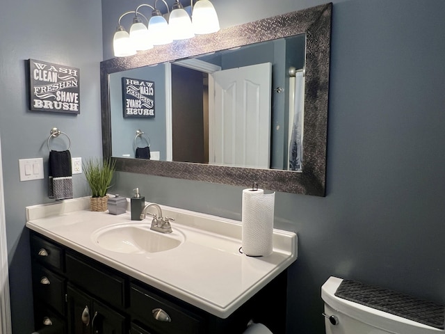 bathroom with vanity and toilet