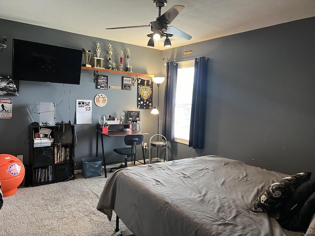 bedroom with ceiling fan and carpet