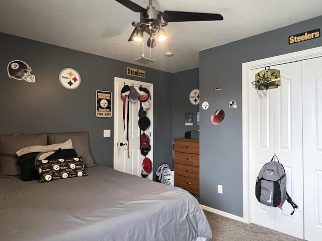 bedroom featuring ceiling fan and carpet