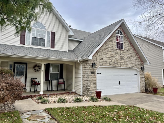 view of front of home with covered porch and a garage