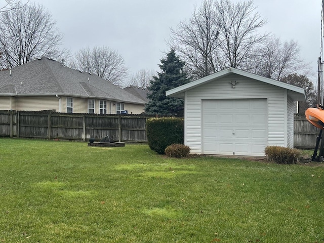 garage featuring a lawn