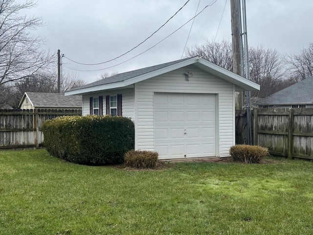 garage featuring a yard