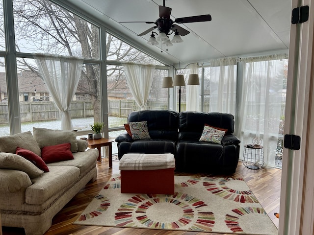 sunroom / solarium featuring ceiling fan