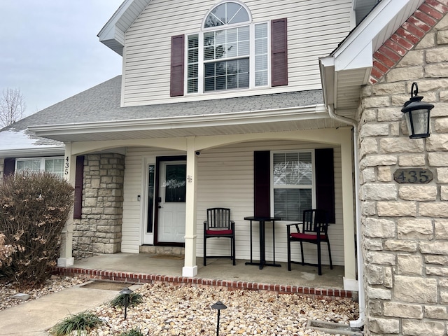 entrance to property featuring covered porch