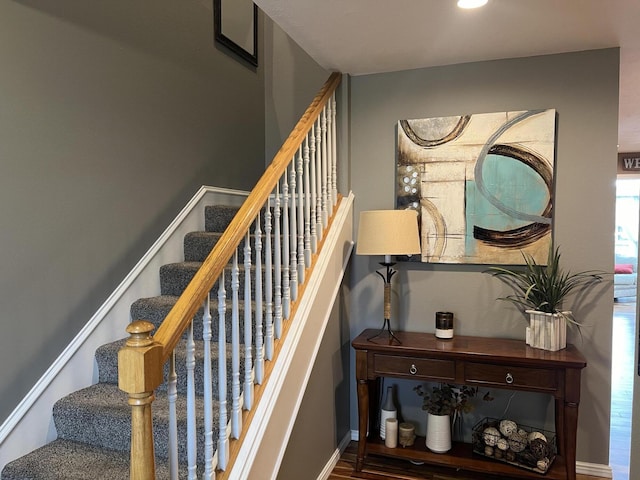 staircase featuring hardwood / wood-style floors