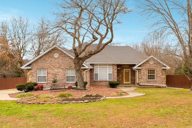 single story home with a front lawn