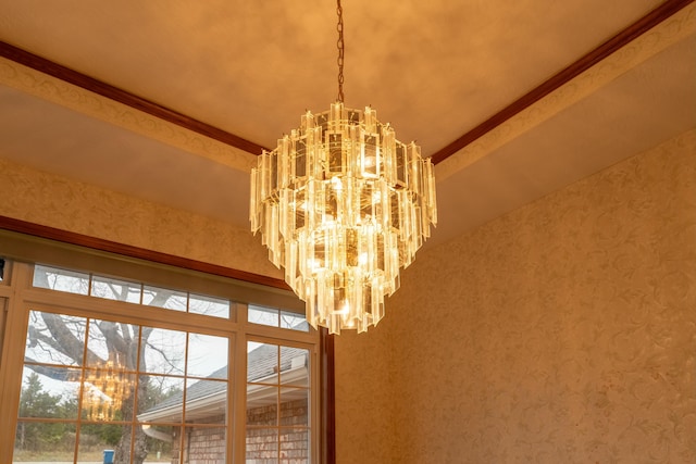 details with a chandelier and beamed ceiling