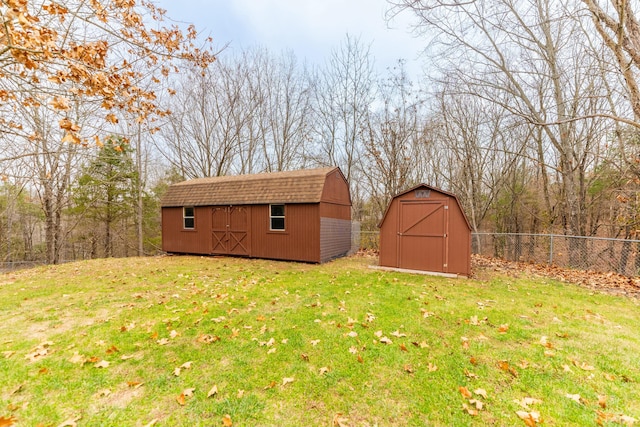 view of outdoor structure featuring a lawn