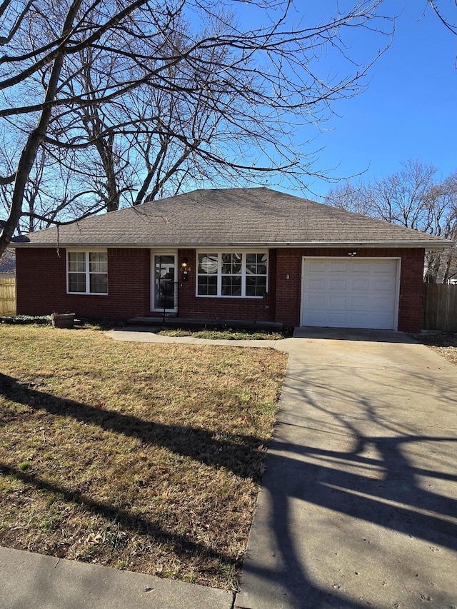 single story home featuring a garage and a front lawn