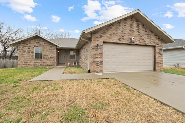 view of front of property with a garage and a front yard