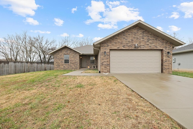 view of front of house with a front yard and a garage