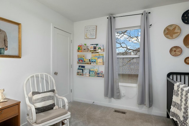 sitting room featuring carpet flooring