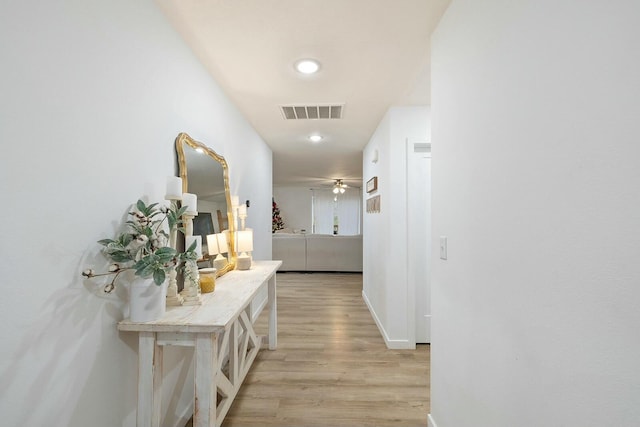 hallway with light wood-type flooring