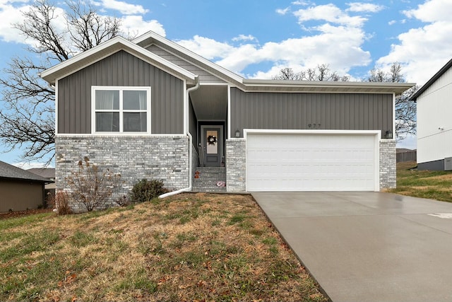 view of front of property with a garage and a front yard