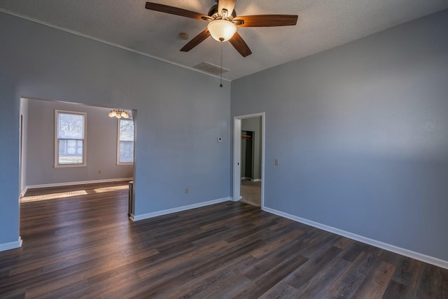 unfurnished room featuring dark hardwood / wood-style floors, a textured ceiling, and ceiling fan with notable chandelier