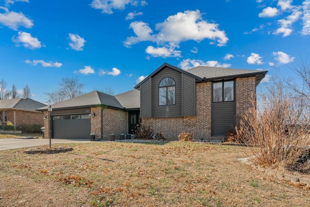 view of front of house with a garage and a front yard