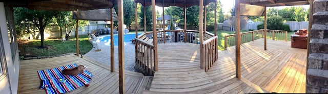 deck with a fenced in pool