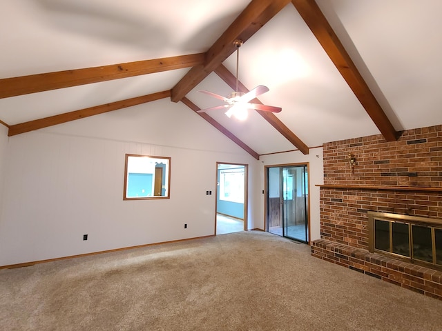 unfurnished living room with lofted ceiling with beams, a brick fireplace, carpet, and ceiling fan