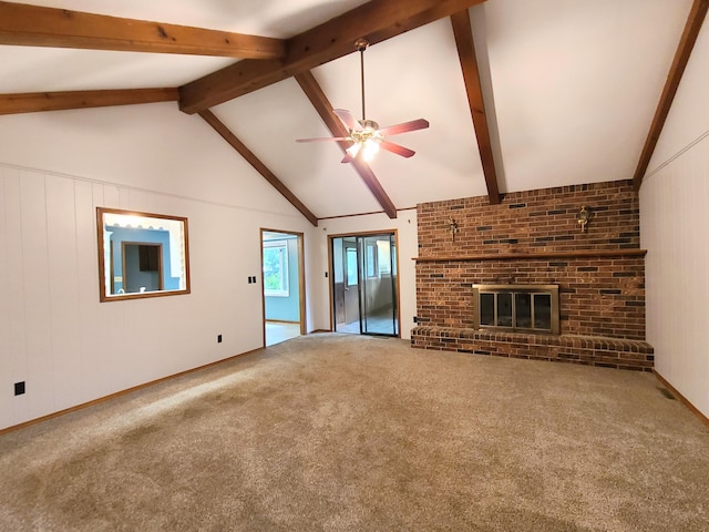 unfurnished living room with ceiling fan, beam ceiling, high vaulted ceiling, carpet flooring, and a fireplace