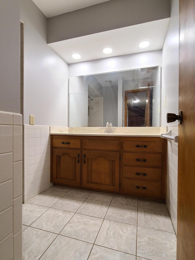 bathroom with vanity, tile walls, and tile patterned floors