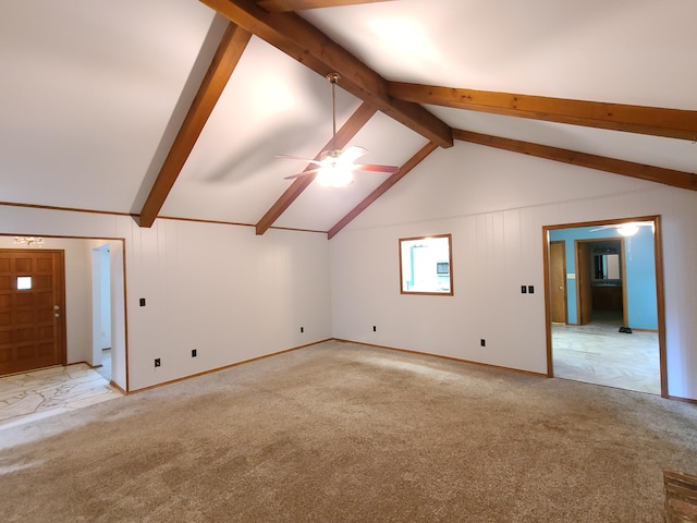 interior space with lofted ceiling with beams, light colored carpet, and ceiling fan