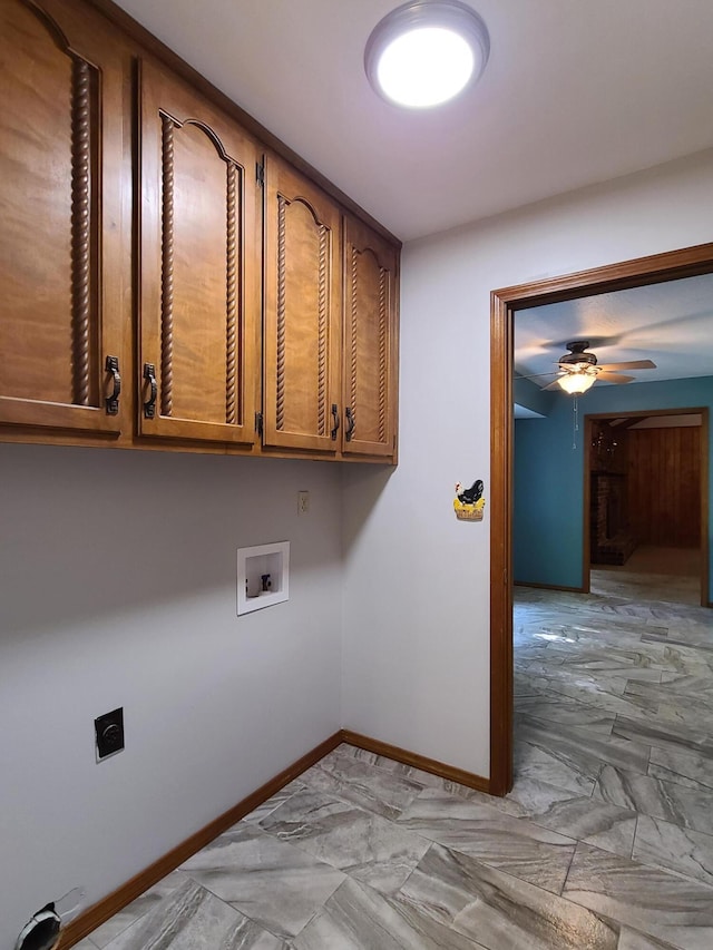 laundry room featuring ceiling fan, cabinets, and washer hookup