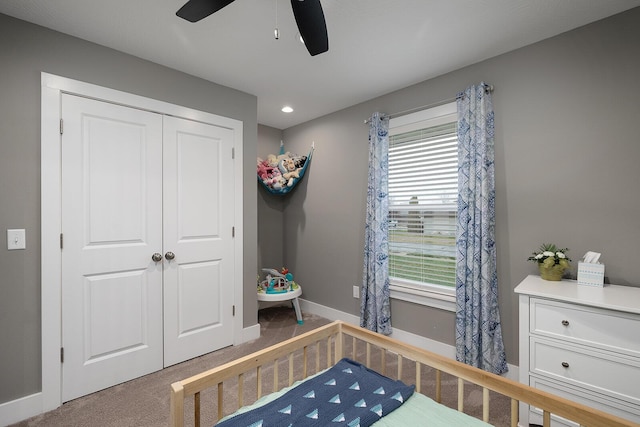 carpeted bedroom with multiple windows, a closet, and ceiling fan