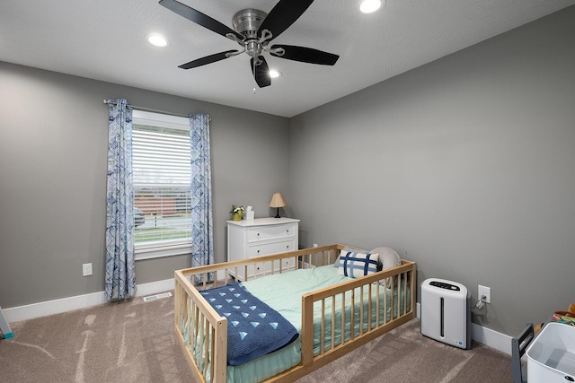 carpeted bedroom with ceiling fan