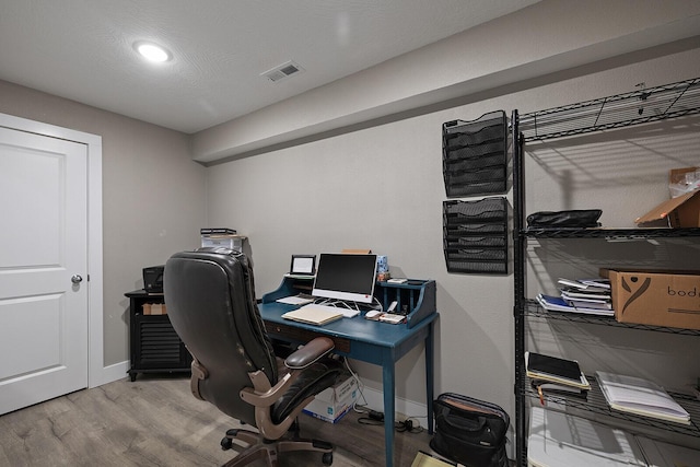 office with hardwood / wood-style flooring