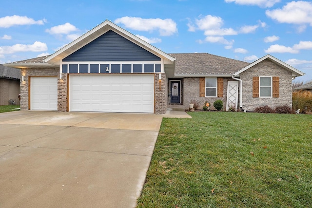 view of front of property featuring a front yard and a garage