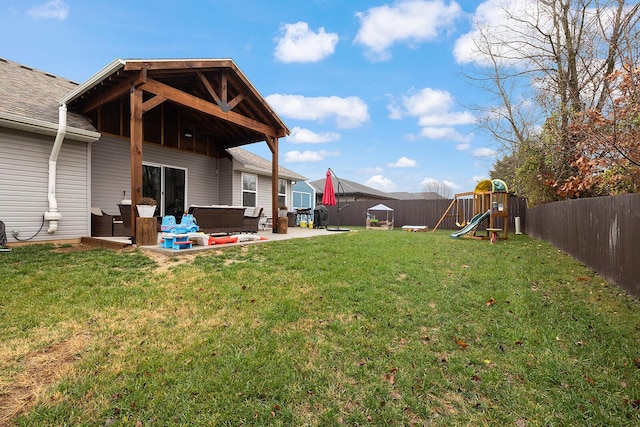 view of yard with an outdoor hangout area, a playground, and a patio