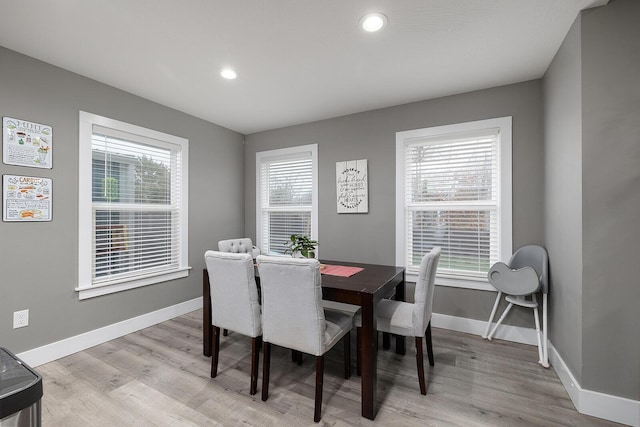 dining space featuring a healthy amount of sunlight and light hardwood / wood-style floors