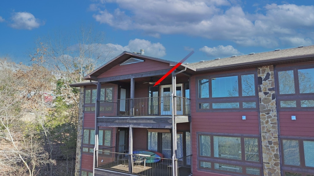 back of house with a balcony