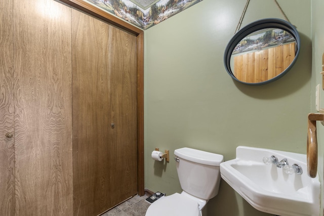 bathroom with sink and toilet