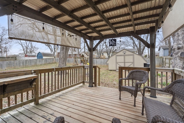 wooden deck featuring a storage unit