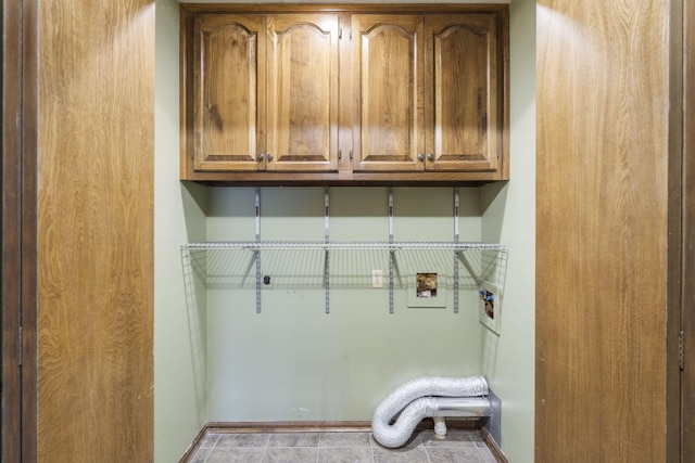 washroom featuring cabinets and washer hookup