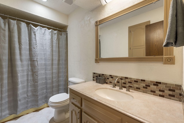 bathroom featuring backsplash, walk in shower, vanity, and toilet